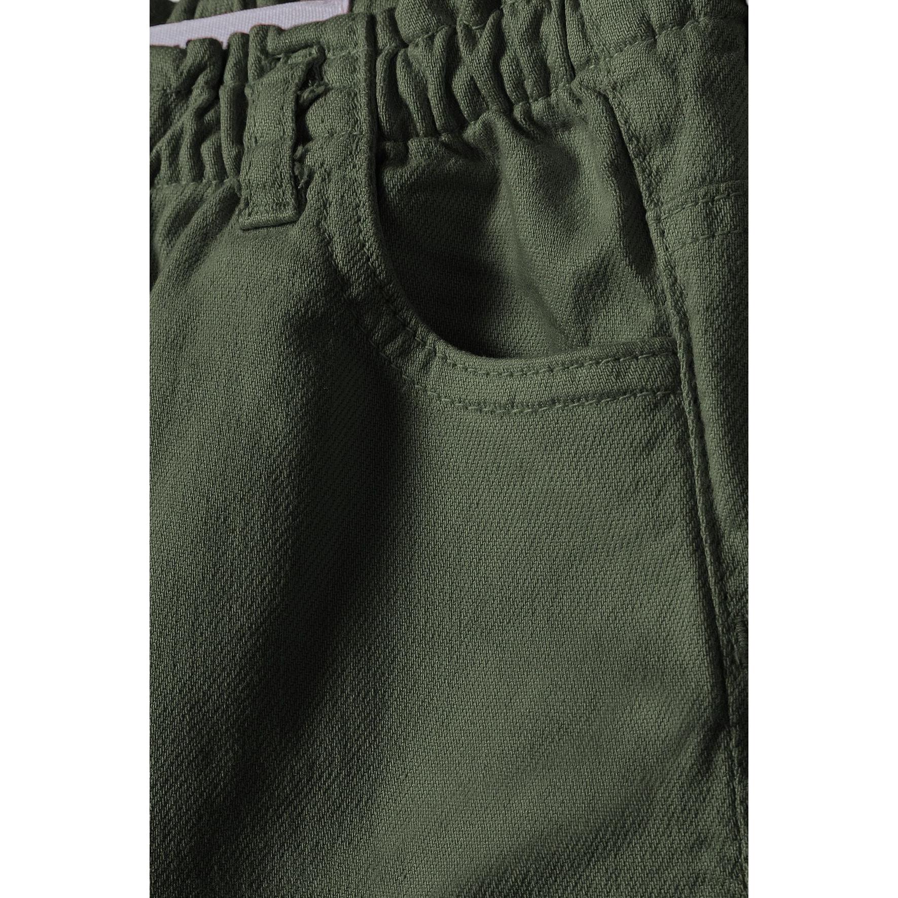 Close-up detail of khaki twill shorts showing fabric texture, front pocket construction and elasticated paperbag waistband