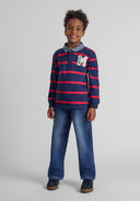 Navy blue and red striped polo with white m embroidery on baggy fit denim jeans