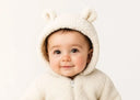 Soft cream-colored fleece bear-ear hooded onesie